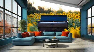 Piano in sunflower field on summer with blue sky Wall mural