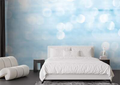 Blurred white light blue glitter abstract bokeh background Wall mural