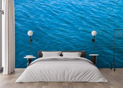 Clear blue sea water surface in sunny day. Wall mural