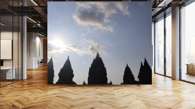 View of a temple in ancient Prambanan temple complex with clear blue sky background. Popular tourist destination. No People. Wall mural