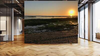 Sea, beach boulders, pebble shore and waves at sunset. Sea waves breaking on rocks. Beach with sand dunes and dusk sky in Esposende, Portugal. Wall mural