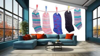 Different women's socks on the clothes line with clothespins Wall mural