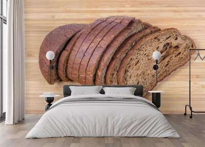 Sliced wheat with rye brown bread on the cutting board Wall mural