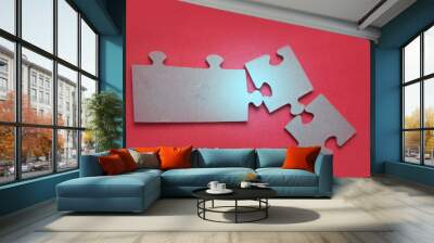 Glowing light on puzzles on red background, closeup Wall mural