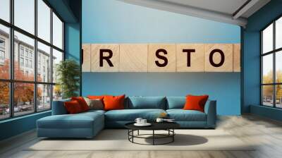 OUR STORY words on wooden cubic building block . Business with history, concept Wall mural