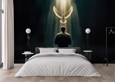 Pentecost concept art. Glowing white dove of the holy spirit descending upon a young christian man. Man on his knees receiving the holy ghost symbolized by a white glowing dove of fire. Wall mural