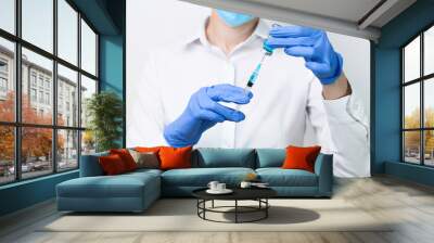 female doctor holding syringe Wall mural