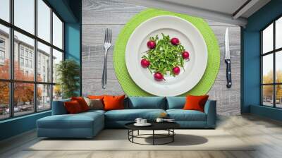 Rocket salad and radishes on a plate Wall mural