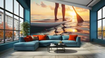 woman balancing on a paddle board Wall mural