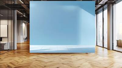 Bright blue wall with soft lighting in empty room during daylight hours Wall mural