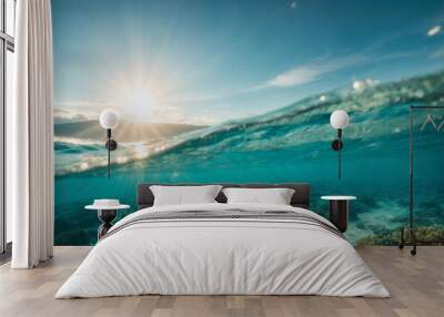 Underwater view of sea water surface with sun rays and blue sky. High quality photo Wall mural