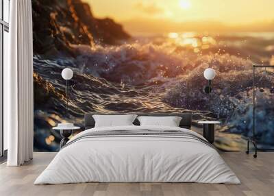 Waves crash on rocks as sun sets over ocean. Wall mural