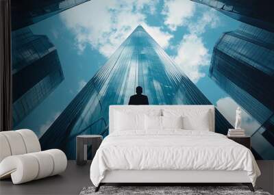 A businessperson ascending an outdoor staircase toward a modern skyscraper symbolizing personal ambition growth and professional success Large space for text in center Stock Photo with copy space Wall mural