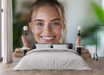 A smiling female professional giving a thumbs up with enthusiasm representing positive outcomes and encouragement isolated on a white background Large space for text in center Stock Photo with copy Wall mural