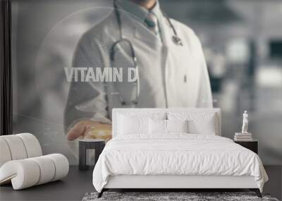 Doctor holding in hand Vitamin D Wall mural