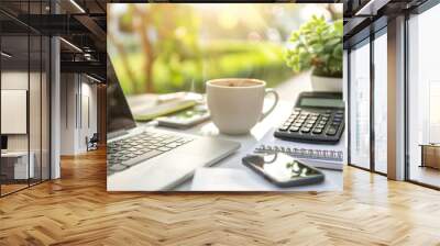 A laptop, calculator, phone, and coffee cup are on a desk Wall mural