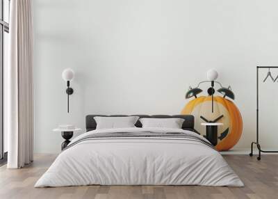 Halloween style alarm clock in the shape of a pumpkin. Time change in the fall.  Wall mural