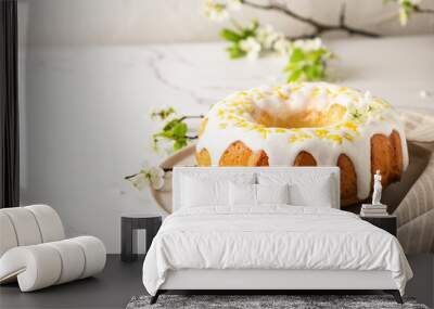 Homemade lemon cake decorated with white glaze and zest Wall mural