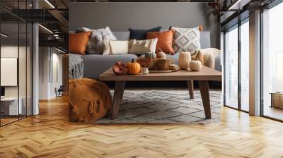 a cozy fall-palette living room interior with various cushions and autumn pumpkin decor Wall mural