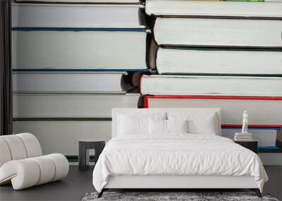 stacks of books of different sizes Wall mural