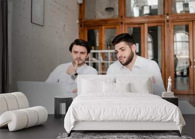 two co workers discuss business in the office Wall mural