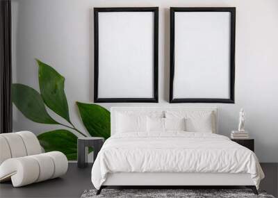 two dark wooden frame with green leaves Wall mural