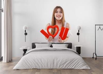 woman with red i love you letters and heart shaped figure isolated over white background Wall mural