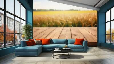 empty wooden table top for product display montages with blurred sunny wheat field view background Wall mural