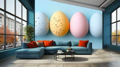 pastel color easter eggs on pastel blue studio background, banner with copyspace, top view Wall mural