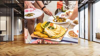 Hungry people are having a lunch with fruit plate with El Nido text cut, Palawan island, Philippines Wall mural