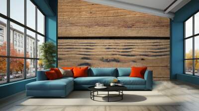  A close-up view of two wooden planks showcasing visible grain patterns and dark stains.  Wall mural