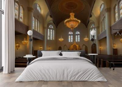 A serene and empty church interior featuring beautiful chandeliers and stained glass windows. The altar at the far end adds a sense of peace and reverence to the scene.. AI Generation Wall mural