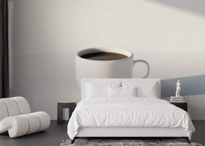 A simple white coffee mug filled with hot black coffee on a clean white background Wall mural