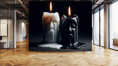 A stark black background illuminates two candles, one white and one black, with wax dripping and flames lit.. AI Generation Wall mural