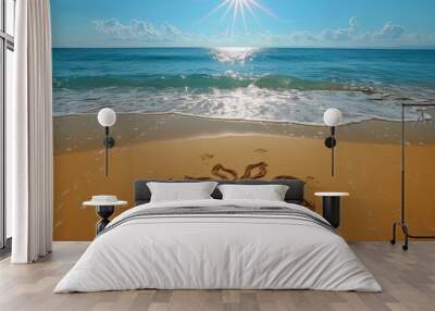 A sunny beach vacation with a sun drawn in the sand under a bright blue sky and ocean waves Wall mural