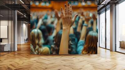 Crowd of people raising hands in a council meeting to discuss suggestions and concepts for democracy in a blurred background. Concept Council Meeting, Democracy Discussion, Group Participation Wall mural