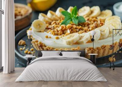 Delicious homemade banana cake pie served on black plate with mint garnish Wall mural