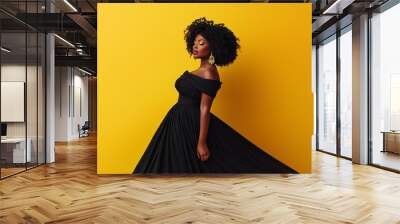 A full body photo of an African American woman with natural hair, plus size model wearing a black off the shoulder ball gown dress against a solid yellow background, with professio Wall mural