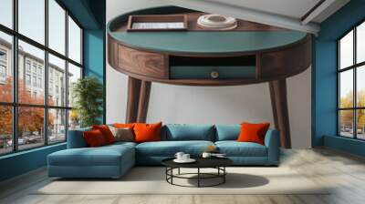 Design of an oil table with teal-painted wood and dark walnut legs, placed in front of white walls, without any objects on top or inside it. T Wall mural