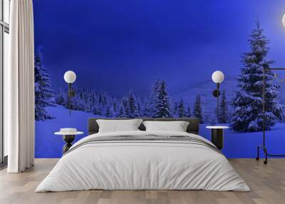 Full Moon rising above the winter fir forest covered of snow in mountains. Landscape winter Wall mural