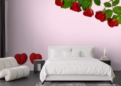 Red roses and red hearts on a pink background with space for text. Top view, flat lay. Valentine decoration. Wall mural