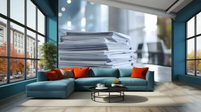 Organized stack of papers on a desk in a contemporary office environment. Concept Office Desk, Organized Papers, Contemporary Environment, Professional Setting Wall mural