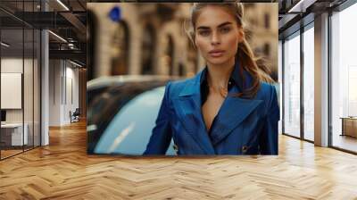 Stylish Woman in Blue Blazer Posing on Urban Street Wall mural