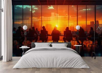 Sunset Strategy Meeting, diverse group of professionals engaged in a brainstorming session, silhouetted against a vibrant sunset through large windows of a modern office Wall mural