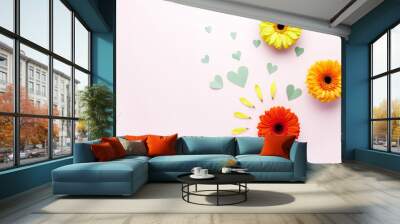 The concept of hello spring. Valentine's Day. Gerbera flower and hearts fly nearby. Flat lay. Wall mural