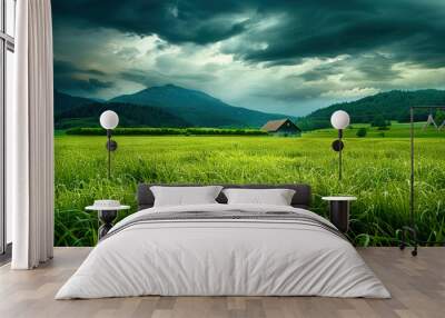 A green field on a mountain landscape Wall mural