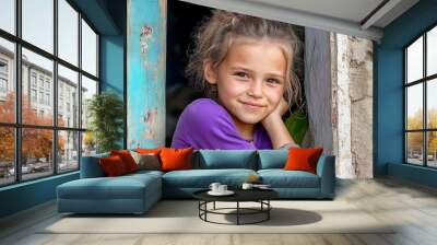 Happy and Smiling Cute Gypsy Girl Despite Difficult Circumstances: Capturing Joy and Resilience in Challenging Environments. Wall mural