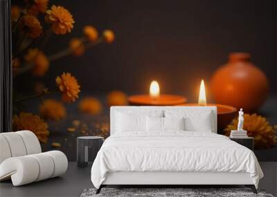 Diwali decor with diyas and marigold flowers. Two traditional clay oil lamps with flames, surrounded by marigold flowers and petals on a dark background, symbolizing festive ambiance. defocus Wall mural