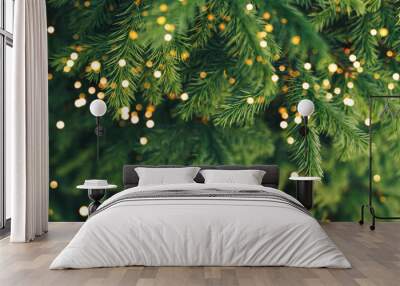 A close-up of a young fir branch with a garland in the summer. Wall mural