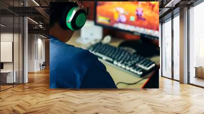 young man playing game on computer, banner Wall mural